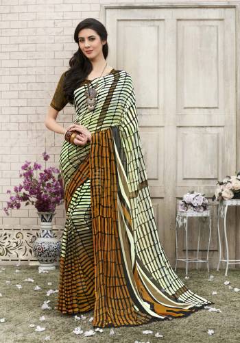 All Color Is Always The Best Color So Grab This Multi colored Saree Paired With Brown Colored Blouse. This Saree And Blouse Are Fabricated On Georgette Beautified With Prints All Over It. Buy This Saree Now.