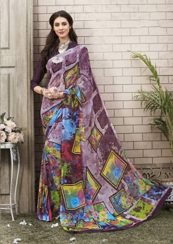 New And Unique Prints Are Here With This Saree In Multi Color Paired With Wine Colored Blouse. This Saree And Blouse Are Fabricated On Georgette Beautified with Unique Prints All Over It. 