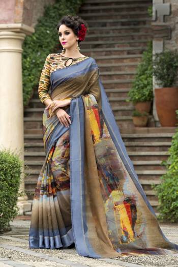 Flaunt Your Elegance Wearing This Saree In Light Brown And Blue Color Paired With Multi Colored Blouse. This Saree And Blouse Are Fabricated On Chanderi Silk Beautified With Multi Colored Prints. 