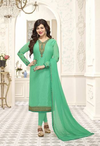 Add This Designer Straight Cut Suit To Your Wardrobe In Light Green Colored Top , Bottom And Dupatta. Its Top Is Fabricated On Brasso Georgette Paired With Santoon Bottom And Chiffon Dupatta. This Suit Is Suitable For Your Party Wear Or Any Social Gatherings.