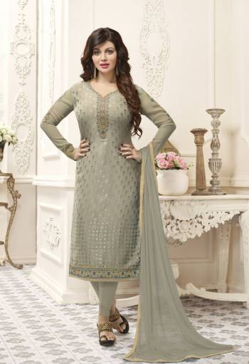 Flaunt Your Rich And Elegant Taste Waring This Designer Floor Length Suit In Grey Color Paired With Grey Colored Bottom And Grey Colored Dupatta. Its Top Is Fabricated On Brasso Georgette Paired With Santoon Bottom And Chiffon Dupatta. It Is Light Weight And Easy To Carry All Day Long.