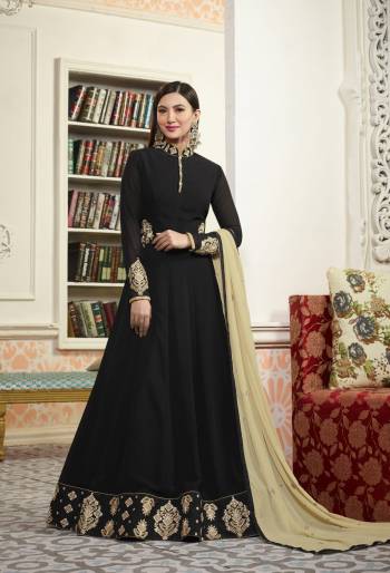 Enhance Your Beauty Wearing This Designer Floor Length Suit In Black Color Paired With Black Colored Bottom And Beige Colored Dupatta. Its Top Is Fabricated On Georgette Paired With Santoon Bottom And Chiffon Dupatta. This Elegant Looking Suit Will Give Your Personality A Rich Look Like Never Before.