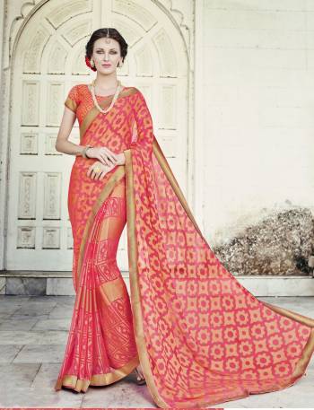 Shine Bright Wearing This Saree In Orange Color Paired With Orange Colored Blouse. This Saree And Blouse Are Fabricated On Chiffon Brasso Beautified With Prints. This Saree Is Light Weight And Easy To Drape, Buy Now.