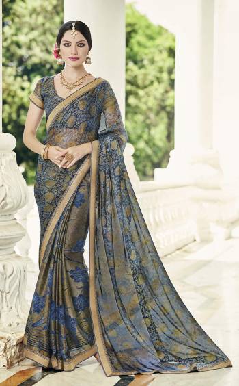 For A Rich And Elegant Look, Grab This Saree In Grey And Blue Color Paired With Grey And Blue Colored Blouse. This Saree And Blouse Are Fabricated On Chiffon Brasso Beautified With Prints All Over It. Buy Now.