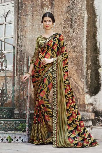 Add This New Shade In Green To Your Wardrobe With This Saree In Olive Green Color Paired With Olive Green Colored Blouse. This Saree And Blouse Are Fabricated On Chiffon Brasso Beautified With Prints All Over It.