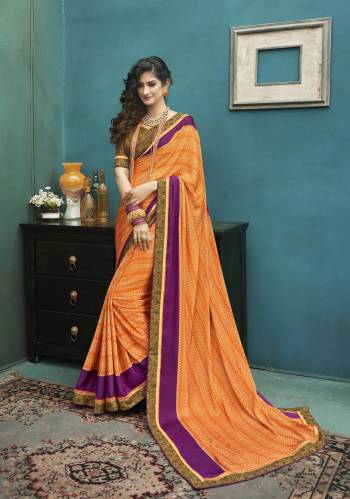 Celebrate This Festive Seaosn Wearing This Pretty Saree In Orange Color Paired With Contrasting Brown Colored Blouse. This Saree And Blouse Are Fabricated On Art Silk. It Is Light Weight, Soft Towards Skin And Easy To carry All Day Long. 