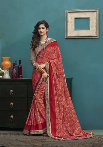 Adorn The Angelic Look Wearing This Saree In Red Color Paired With Contrasting Grey Colored Blouse. This Saree And Blouse Are Fabricated On Art Silk Beautified With Small Prints All Over It. 