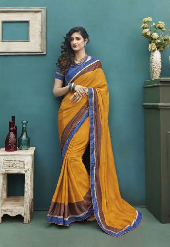 You Will Definitely Earn Lots Of Compliments Wearing This Bright And Visually Appealing Saree In Yellow Color Paired With Contrasting Blue Colored Blouse, This Saree And Blouse Are Fabricated On Art Silk Beautified With Light Prints All Over. Buy This Pretty Saree Now.