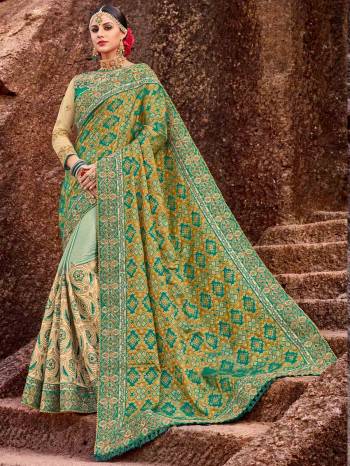 Presenting this green color two tone silk jacquard and sparkle lycra heavy embroidered work saree. Ideal for party, festive & social gatherings. this gorgeous saree featuring a beautiful mix of designs. Its attractive color and designer embroidered design, patch design, stone, heavy designer blouse, cut paste design saree, beautiful floral design work over the attire & contrast hemline adds to the look. Comes along with a contrast unstitched blouse.