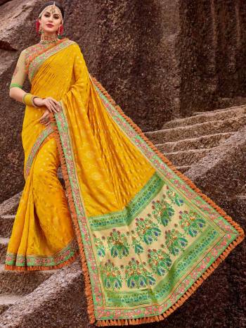 Flaunt a new ethnic look wearing this yellow and green color two tone satin jacquard and sparkling lycra heavy embroidered work saree. Ideal for party, festive & social gatherings. this gorgeous saree featuring a beautiful mix of designs. Its attractive color and designer embroidered design, patch design, stone, heavy designer blouse, beautiful floral design work over the attire & contrast hemline adds to the look. Comes along with a contrast unstitched blouse.