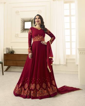 Look Like A Queen Wearing This Designer Floor Length Suit In Maroon Color Paired With Maroon Colored Bottom And Dupatta. Its Top Is Fabricated On Georgette Paired With Santoon Bottom And Chiffon Dupatta. It Is Beautified With Heavy Embroidery Making The Suit More Attractive. Buy Now.