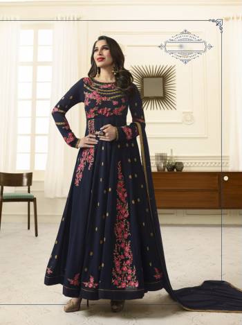 Another Heavy Embroidered Designer Floor Length Suit Is Here In Navy Blue Color Paired With Navy Blue Colored Bottom And Dupatta. Its Top Is Fabricated On Georgette Paired With Santoon Bottom And Chiffon Dupatta. It Has Contrasting Embroidery All Over The Top. 