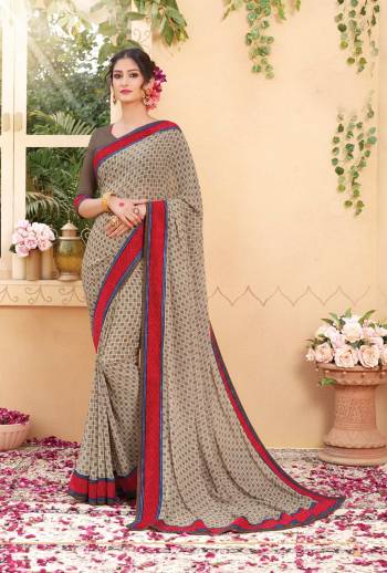 Grab This Checks Printed Saree In Grey Color Paired With Grey Colored Blouse. This Saree And Blouse are Fabricated On Georgette Which Is Light Weight And Easy To Carry All Day Long.