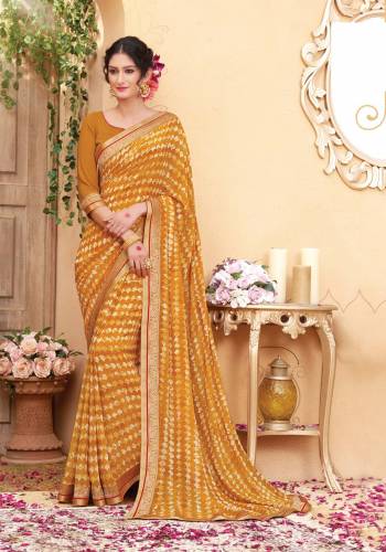 Add This Pretty Saree With Pretty Unique Color In Musturd Yellow Colored Saree Paired With Musturd Yellow Colored Blouse. This Saree And Blouse Are Fabricated On Georgette Beautified With Simple Prints And Lace Border. Buy It Now.