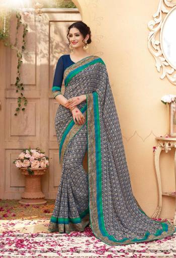 Add Some Casuals With This Saree In Blue And White Color Paired With Navy Blue Colored Blouse. This Saree And Blouse Are Fabricated On Georgette Beautified With Simple Prints All Over It. Buy Now.