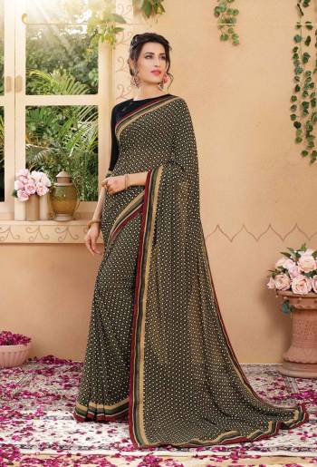 Enhance Your Beauty Wearing This Saree In Black Color Paired With Black Colored Blouse. This Saree And Blouse Are Fabricated On Georgette Beautified With Intricate Prints All Over It. Buy This Saree Now.