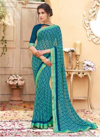 Look Simply Pretty In This Blue Colored Saree Paired With Blue Colored Blouse. This Saree And Blouse are Fabricated On Georgette Beautified With Prints. It Is Light Weight And easy To Carry All Day Long. 