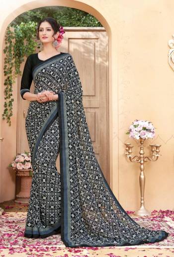 Enhance Your Beauty Wearing This Saree In Black Color Paired With Black Colored Blouse. This Saree And Blouse Are Fabricated On Georgette Beautified With Intricate Prints All Over It. Buy This Saree Now.