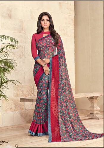 Go Floral Wearing This Saree In Navy Blue Color Paired With Contrasting Red Colored Blouse, This Saree And Blouse Are Fabricated On Georgette Beautified With Floral Prints All Over The Saree. Buy Now.