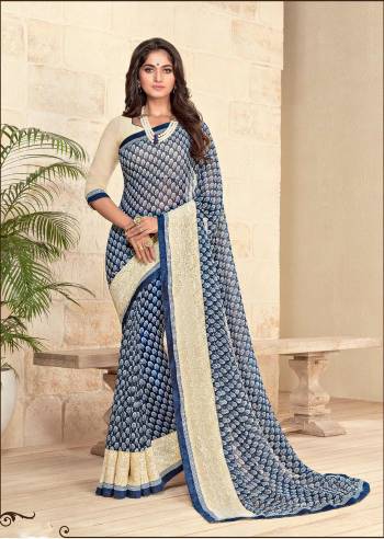 Add Some Casuals With This Saree In Blue And White Color Paired With White Colored Blouse. This Saree And Blouse Are Fabricated On Georgette Beautified With Simple Prints All Over It. Buy Now.