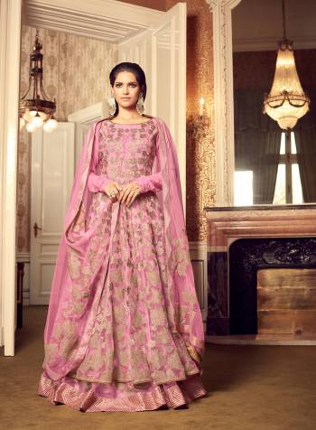 Look Pretty In This Designer Floor Length Suit In Pink Color Paired With Pink Colored Bottom And Dupatta. Its Top Is Fabricated On Net Paired With Santoon Bottom And Net Dupatta. Its  Has Beautiful Fancy Jari Work. This Suit Is Light Weight And Easy To Carry All Day Long. Buy Now.