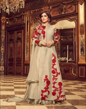 You Will Definitely Earn Lots Of Compliments Wearing This Designer Floor Length Suit In Grey Color Paired With Grey Colored Bottom And Dupatta. Its Top Is Fabricated On Art Silk Paired With Santoon Bottom And Chiffon Dupatta. Its Is Beautified With Contrasting Maroon Colored Resham Work Making The Suit Attractive. Buy This Suit Now.