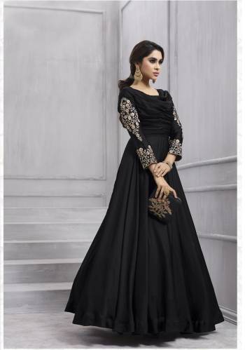 Enhance Your Beauty Wearing This Designer Floor Length Suit In Black Colored Top Paired With Black Colored Bottom And Dupatta. Its Top Is Fabricated On Art Silk Paired With Santoon Bottom And Chiffon Dupatta. It Has Embroidery Over The Sleeves Makign The Suit More Elegant. It Also Ensures Superb Comfort Throughout The Gala.