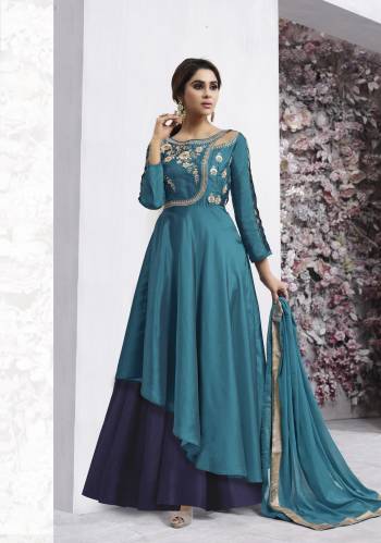 Fully Stitched Suit Is Here With This Designer Suit In Blue Colored Top Paired With Navy Blue Colored Lehenga And Blue Colored Dupatta. Its Top Is Fabricated On Art Silk Paired With Soft Silk Lehenga And Chiffon Dupatta. This Designer Indo-Western Suit Will Earn You Lots Of Compliments From Onlookers.