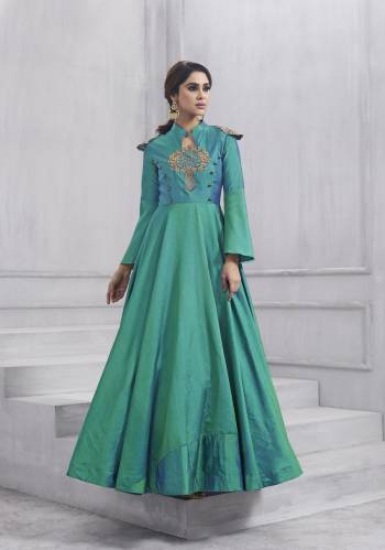 New Patterned Designer Floor Length Suit Is Here In Turquoise Blue Color Paired With Turquoise Blue Colored Bottom And Dupatta. Its Top Is Fabricated On Art Silk Paired With Santoon Bottom And Chiffon Dupatta. This Suit Has Beautiful Sleeve Pattern Which Also Ensures Great Comfort.