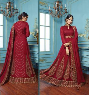 Get Ready For Thr Upcoming Festive And Wedding Season Wearing This Beautiful Designer Floor Length Suit In Maroon Color Paired With Maroon Colored Bottom And Dupatta. Its Top Is Fabricated On Georgette Paired With Santoon Bottom And Georgette Dupatta. Its Top And Dupatta Is Beautified With Heavy Jari Embroidery And Stone Work. Grab It Soon.