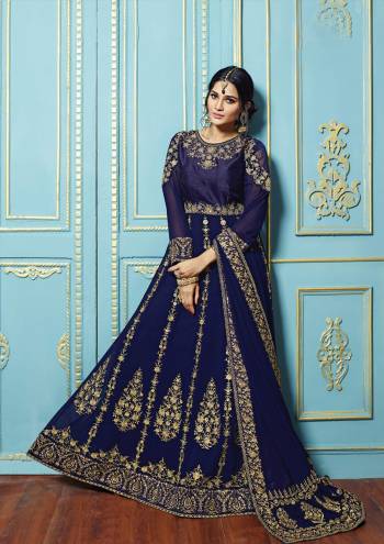 Celebrate This Upcoming Festive And Wedding Season With Such Heavy Designer Suits. One Of The Beautiful Designer Floor Length Suit Is Here In Blue Colored Top Paired With Blue Colored Bottom And Dupatta. Its Top Is Fabricated On Georgette Paired With Santoon Bottom And Georgette Dupatta. Its HAs Attractive HEavy Embroidery Over The Top And Dupatta. Buy This Pretty Suit Now.