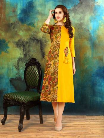 For Your Semi-Casual Wear, Grab This Pretty Readymade Kurti In Yellow Color Fabricated On Rayon Cotton Beautified With Prints. It Is Available In Many Sizes. Buy This Kurti Now.