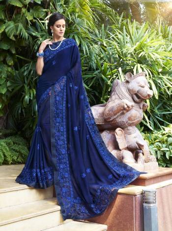 Get Ready For The Upcoming Festive Season Wearing This Saree In Bright Blue Color Paired With Blue Colored Blouse. This Saree Is Fabricated On Georgette Paired With Art Silk Fabricated Blouse. It Is Beautified with Tone To Tone Resham Embroidery With Stone Work. Buy Now.