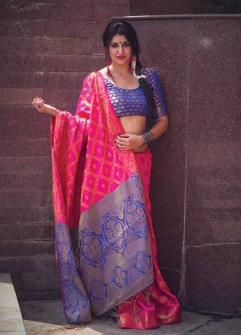 For A Glam Look, Grab This Very Pretty Saree In Fuschia Pink Color Paired With Contrasting Royal Blue Colored Blouse. This Saree And Blouse Are Fabricated On Banarasi Art Silk Beautified With Weave All Over It. This Saree Will Definitely Earn You Lots Of Compliments From Onlookers.