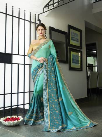 Shades Are Always In , So Grab This Shaded Saree In Shades Of Turquoise Blue Paired With Beige Colored Blouse. This Saree Is Fabricated On Chiffon Silk Paired With Art Silk Fabricated Blouse. This Designer Saree Is Suitable For All Occasion Wear. Buy Now.