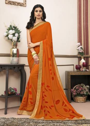 Beat The Heat With Bright Summery Colors With This Casual Saree In Orange Color Paired With Beige Colored Blouse. This Saree Is Fabricated On Georgette Paired With Cotton Fabricated Blouse. It Is Very Simple Prints Over Saree.