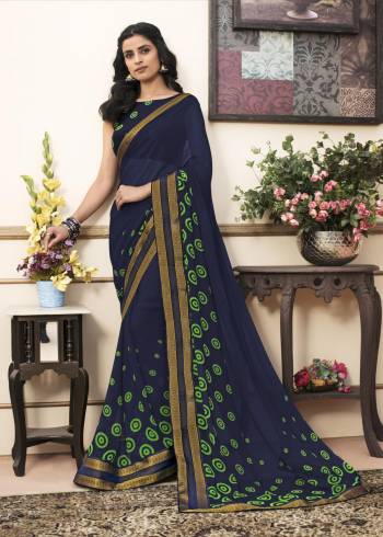 Here Is A Saree Which Gives A Bold And Beautiful Look To Your Personality, Grab This Saree In Navy Blue Color Paired With Navy Blue Colored Blouse. This Saree Is Fabricated On Georgette Paired With Cotton Fabricateed Blouse. It Has Simple Polka Dots Prints. 