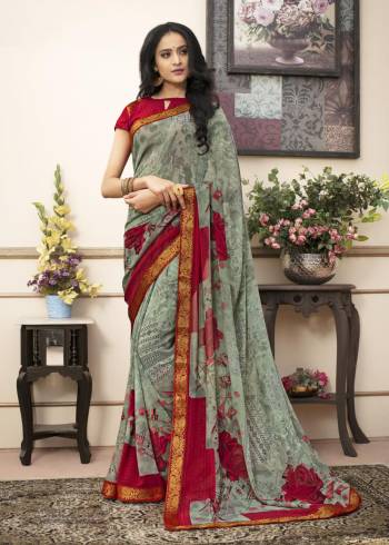 Enhance Your Personality Wearing This Simple And Elegant Looking Saree In Grey Color Paired With Contrasting Red Colored Blouse. This Saree Is Fabricated On Georgette Paired With Cotton Fabricated Blouse. 