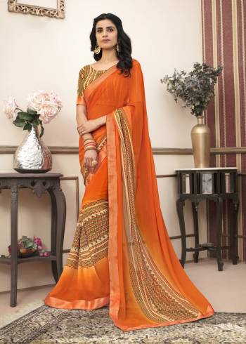 Beat The Heat With Bright Summery Colors With This Casual Saree In Orange Color Paired With Multi Colored Blouse. This Saree Is Fabricated On Georgette Paired With Cotton Fabricated Blouse. It Is Very Simple Prints Over Saree.