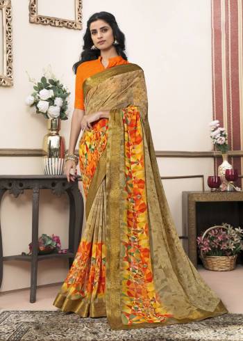 Grab This Saree In Light Brown Color Paired With Orange Colored Blouse. This Saree Is Fabricated On Georgette Paired With Cotton Fabricated Blouse. It Is Beautified With Prints All Over IT. Buy Now.