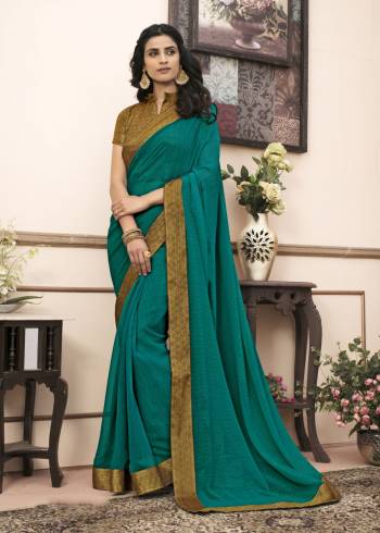 A Must Have Shade In Every Womens Wardrobe, Grab This Saree In Teal Green Color Paired With Golden Colored Blouse. This Saree Is Fabricated On Georgette Paired With Cotton Fabricated Blouse. It Is Light Weight, Easy To Drape And Easy To care For.