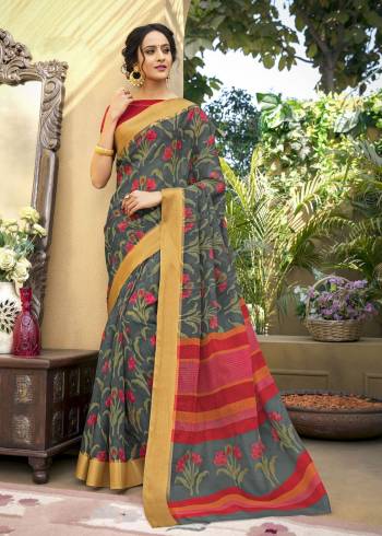 Go Floral With This Pretty Saree In Grey And Red Color Paired With Red Colored Blouse. This Saree Is Fabricated On Chanderi Art Silk Paired With Chanderi Art Silk Fabricated Blouse. It Has Lovely Floral Prints Which Makes The Saree More Attractive.