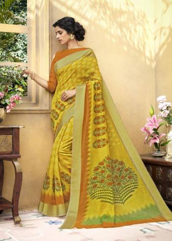 This Summer Beat The Heat With Bright  Attractive Colors Wearng This Saree In Yellow Paired With Contrasting Orange Colored Blouse. This Saree Is Fabricated On Chanderi Art Silk Paired With Cotton Satin Fabricated Blouse. It Has Floral Prints Over the Saree Making It More Pretty.