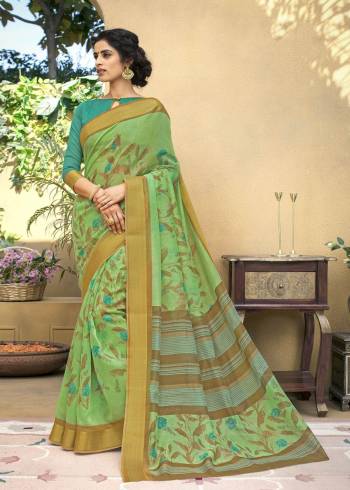 Grab This Pretty Saree In Green Color Paired With Contrasting Blue Colored Blouse. This Saree Is Fabricated On Chanderi Art Silk Paired With Lycra Fabricated Blouse. Both Its Fabrics Are Durable And Easy To care For.