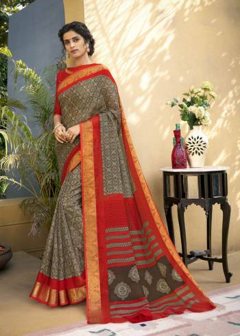 Go Floral With This Pretty Saree In Grey Color Paired With Red Colored Blouse. This Saree Is Fabricated On Chanderi Art Silk Paired With Cotton Satin Fabricated Blouse. It Has Lovely Floral Prints Which Makes The Saree More Attractive.