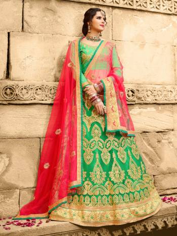 Go Colorful Wearing This Pretty Combined Designer Lehenga Choli In Green Color Paired With Contrasting Fuschia Pink Colored Dupatta. Its Blouse Is Fabricated On Art Silk Paired With Net Fabricated Lehenga And Dupatta. It Is Light Weight And Easy To Carry Throughout The Gala.