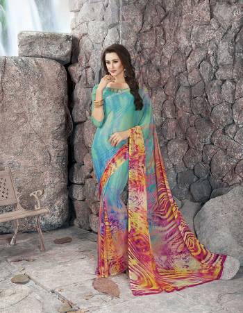 Go Colorful Wearing This Saree In Blue And Multi Color Paired With Blue Colored Blouse. This Saree And Blouse Are Fabricated On Georgette Beautified With Prints All Over It. It Is Light In Weight And Easy To Carry All Day Long. 