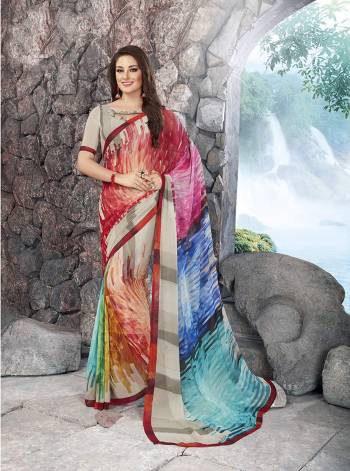 A Very Pretty Colorful Saree Is Here In Multi Color Paired With Grey Colored Blouse. This Saree And Blouse Are Fabricated On Georgette Beautified With Prints All Over. Buy This Saree Now.