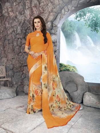 Bright And Visually Appealing Colored Saree Is Here With This Orange Colored Saree Paired With Orange Colored Blouse. This Saree And Blouse Are Fabriacted On Georgette Beautified With Minimal Prints. 