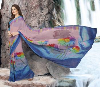 New And Unique Combination Is Here With This Saree In Mauve And Blue Color Paired With Blue Colored Blouse. This Saree And Blouse Are fabricated On Georgette Beautified With Bold Floral Prints All Over. It Is Light Weight And Easy To carry All Day Long.